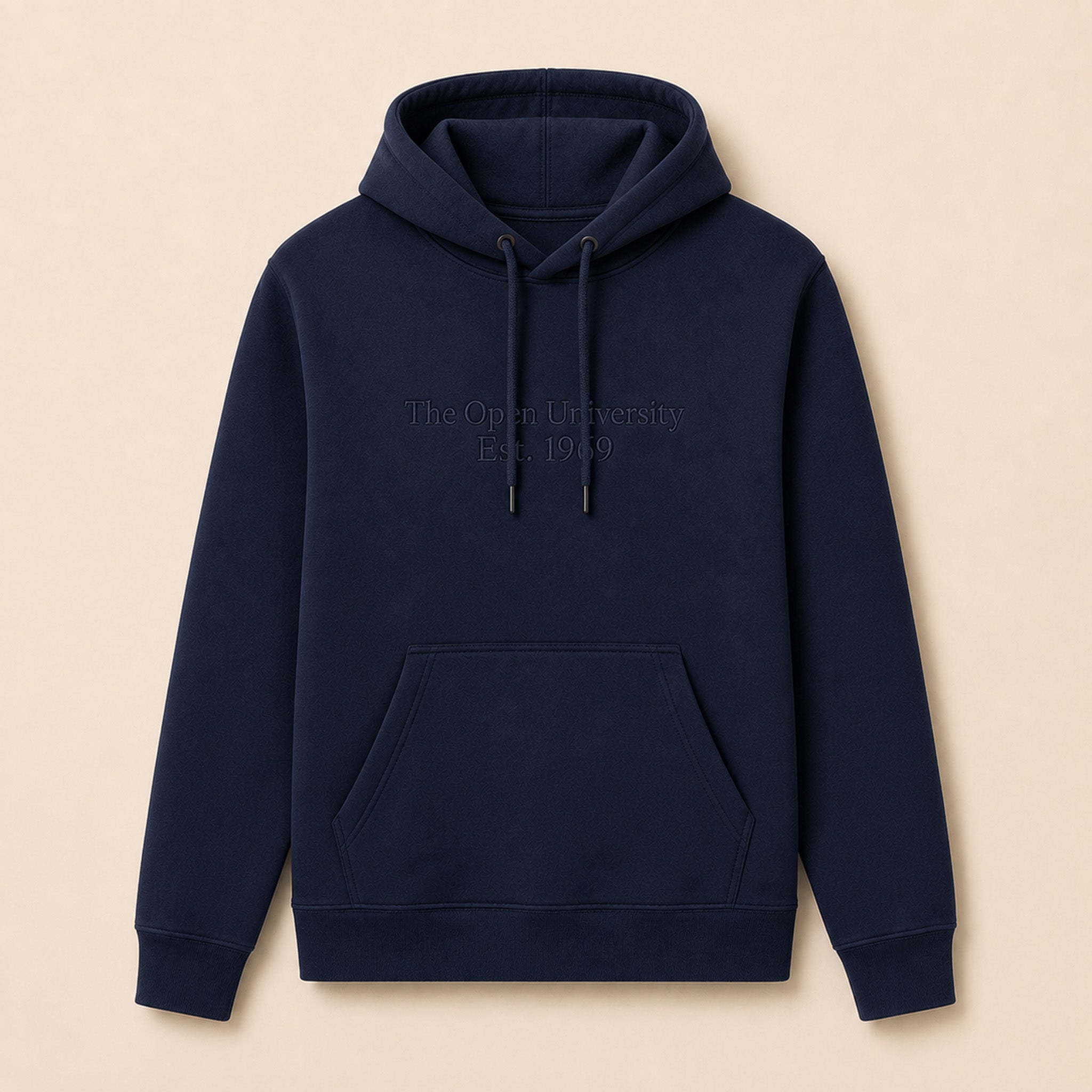 A navy blue pullover hoodie with 'The Open University Est. 1969' embroidered in light gray on the chest, displayed flat against a warm beige background.